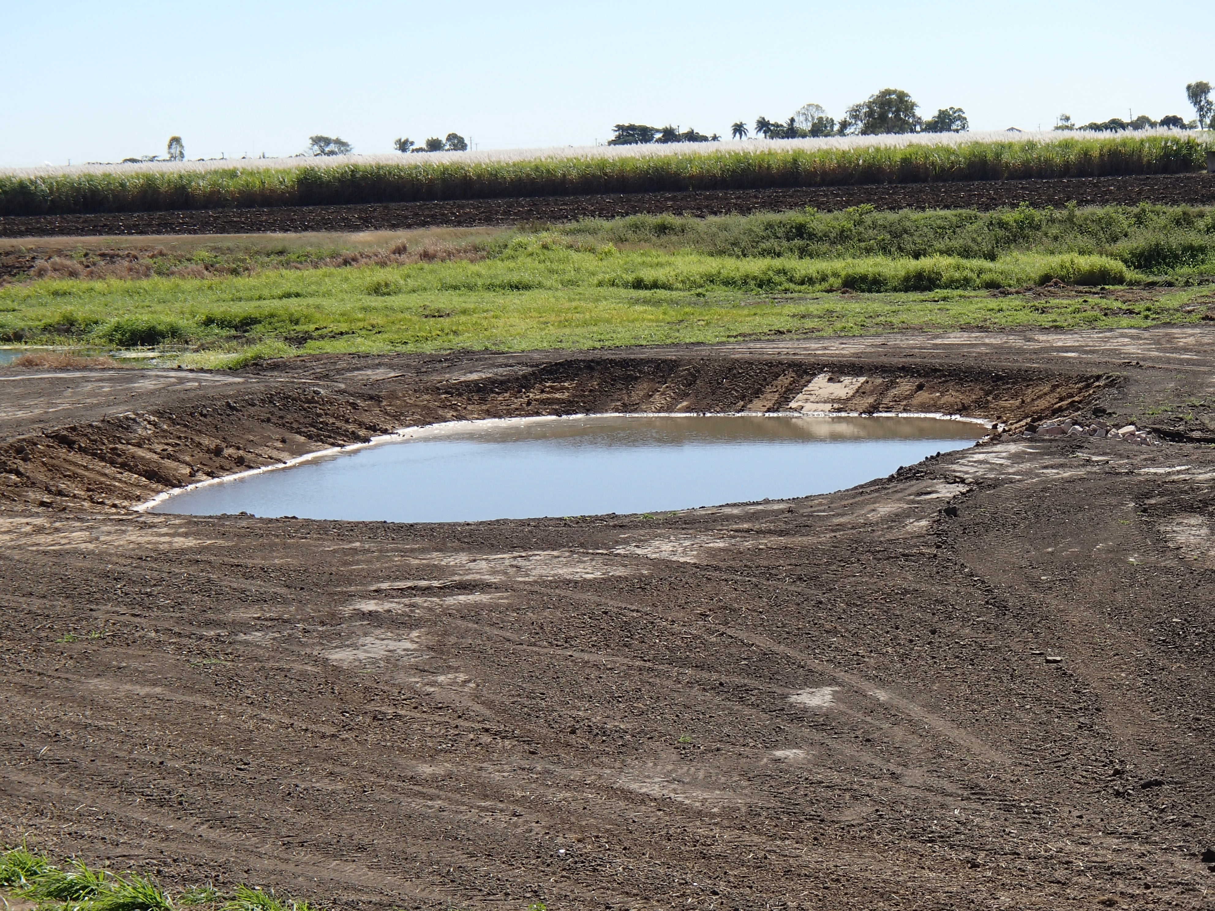 Figure 1 Newly constructed sediment basin on a cane farm. Photo by Queensland Government